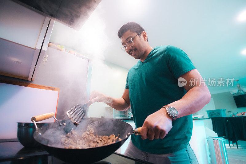 Cooking at Home - Sautéed Mushrooms - Cooking on a Wok - Low Angle